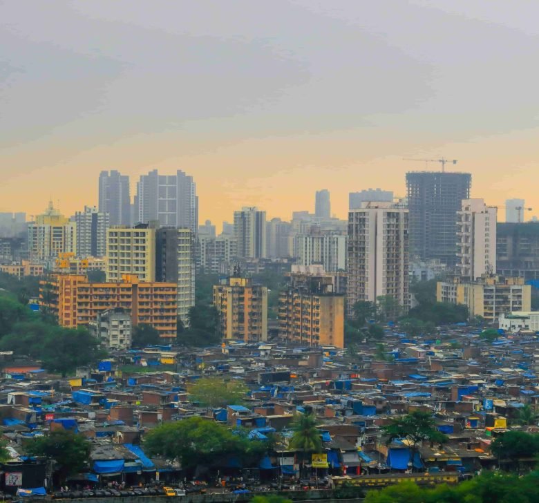 dense-urban-slum-next-to-modern-city-buildings-2026-03-09-06-04-06-utc (1)