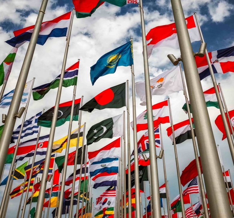 flags-of-the-world-waving-against-cloudy-sky-2026-01-07-23-16-12-utc (1)