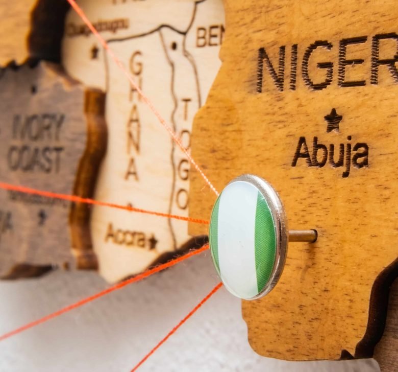 wooden-map-of-nigeria-with-a-pin-2026-03-09-02-59-25-utc (1)